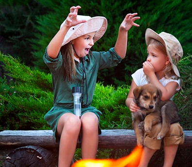 Photo of 2 kids by the camp fire to share photos