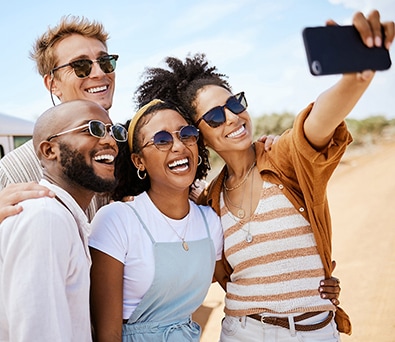 Group of friends taking photos to share